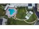 Overhead view of community amenities including a pool, shuffleboard, patio and lush landscaping at 100 Bluff View Dr # 510A, Belleair Bluffs, FL 33770