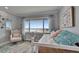 Bedroom with a large window with view, chair, and wicker bed frame at 100 Bluff View Dr # 510A, Belleair Bluffs, FL 33770