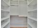 Bright, organized walk-in closet with lots of shelves and hanging space at 100 Bluff View Dr # 510A, Belleair Bluffs, FL 33770