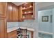 Well-organized kitchen with a built-in desk and charming display shelves with decor at 100 Bluff View Dr # 510A, Belleair Bluffs, FL 33770