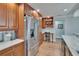 Well-equipped kitchen with stainless steel refrigerator and a built-in desk area at 100 Bluff View Dr # 510A, Belleair Bluffs, FL 33770