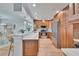 Well-appointed kitchen with wooden cabinets, stainless steel appliances, and a breakfast bar at 100 Bluff View Dr # 510A, Belleair Bluffs, FL 33770