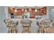 This updated kitchen features wood cabinets, stainless appliances and bar seating at 100 Bluff View Dr # 510A, Belleair Bluffs, FL 33770