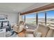 This living room features recliners offering scenic views of the city and the water at 100 Bluff View Dr # 510A, Belleair Bluffs, FL 33770