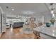 Bright living room and dining area with stylish bar seating featuring stunning bay views at 100 Bluff View Dr # 510A, Belleair Bluffs, FL 33770