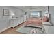 Spacious main bedroom with lots of natural light, white furniture, calming colors and a great view at 100 Bluff View Dr # 510A, Belleair Bluffs, FL 33770