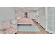 Comfortable main bedroom with lots of natural light, calming color palette, and white furniture at 100 Bluff View Dr # 510A, Belleair Bluffs, FL 33770