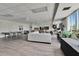 Large recreation room with Ping Pong table, gray sofas, and community amenities at 100 Bluff View Dr # 510A, Belleair Bluffs, FL 33770
