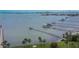 Scenic waterfront view featuring docks, and lush landscaping creating a serene and inviting atmosphere at 100 Bluff View Dr # 510A, Belleair Bluffs, FL 33770