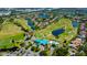 Aerial view featuring community golf course, ponds and landscaping around this property at 10035 82Nd St, Seminole, FL 33777