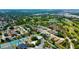 Aerial view showcasing proximity to tennis courts, golf course, neighborhood lakes and nearby amenities at 10035 82Nd St, Seminole, FL 33777