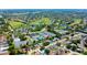 Aerial view showing the property's location near tennis courts, neighborhood pools and golf courses at 10035 82Nd St, Seminole, FL 33777