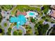 Aerial view of the community clubhouse, pool, outdoor seating and immaculately maintained grounds at 10035 82Nd St, Seminole, FL 33777