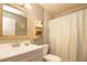 Well-lit bathroom with a vanity, toilet, and shower/tub combination at 10035 82Nd St, Seminole, FL 33777