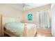 Comfortable bedroom featuring a bed, ceiling fan, and closet at 10035 82Nd St, Seminole, FL 33777