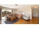 Cozy living room with hardwood floors, comfortable seating, and natural light at 10035 82Nd St, Seminole, FL 33777
