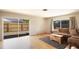 Bright living room with hardwood floors and sliding glass doors to the backyard at 10035 82Nd St, Seminole, FL 33777