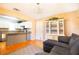 Open-concept living space featuring hardwood floors and views of the adjacent kitchen at 10035 82Nd St, Seminole, FL 33777