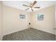 Cozy bedroom features tile flooring and a ceiling fan at 1113 53Rd S St, Gulfport, FL 33707