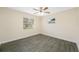 Bright bedroom with wood-look tile flooring and ceiling fan at 1113 53Rd S St, Gulfport, FL 33707