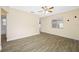 Bedroom features wood-look floors, a ceiling fan, and a window allowing natural light at 1113 53Rd S St, Gulfport, FL 33707
