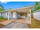 Welcoming covered front porch with lighting, providing a shaded entrance and outdoor living space at 1113 53Rd S St, Gulfport, FL 33707