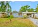Charming single-story home featuring a well-maintained front yard and a covered front entrance at 1113 53Rd S St, Gulfport, FL 33707