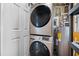 Efficient laundry area features a stacked washer and dryer, maximizing space at 1113 53Rd S St, Gulfport, FL 33707