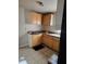 Modest kitchen features cabinetry, tile floors and an eat in area at 1125 Engman St, Clearwater, FL 33755
