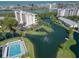 A high rise condo with beautiful waterfront views, a community pool, and mature landscaping at 11520 Shipwatch Dr # 1385, Largo, FL 33774
