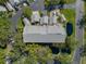 A bird's eye view of a multi-Gathering condo building with designated parking surrounded by mature trees at 11520 Shipwatch Dr # 1385, Largo, FL 33774