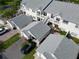 Aerial view of the property featuring the building exterior, roof, and surrounding landscape at 11520 Shipwatch Dr # 1385, Largo, FL 33774