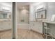 A luxurious bathroom with a tiled shower-tub combo, wood floors and custom vanity at 11520 Shipwatch Dr # 1385, Largo, FL 33774