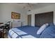Bedroom with closet, light walls, fan, and a window, creating a serene living space at 11520 Shipwatch Dr # 1385, Largo, FL 33774