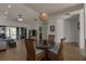 Elegant dining room with wicker chairs, glass table, and sliding doors to the lanai for indoor-outdoor living at 11520 Shipwatch Dr # 1385, Largo, FL 33774