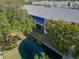 A stunning waterfront condo featuring a serene canal view and lush tropical landscaping at 11520 Shipwatch Dr # 1385, Largo, FL 33774