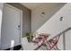 A cozy front porch with a small table and chairs provides a welcoming entrance to the property at 11520 Shipwatch Dr # 1385, Largo, FL 33774