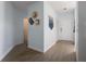 Hallway featuring stylish decor and modern lighting leading to various rooms, enhancing the home's interior at 11520 Shipwatch Dr # 1385, Largo, FL 33774