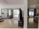Open living area with sliding glass doors to lanai, complemented by light wood floors and neutral decor at 11520 Shipwatch Dr # 1385, Largo, FL 33774