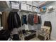 Organized walk-in closet with shelves, rods, baskets, and space for storing clothes and shoes at 11520 Shipwatch Dr # 1385, Largo, FL 33774