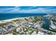 Aerial view of beachside town with beautiful sandy beaches and ocean at 11605 Gulf Blvd # 203, Treasure Island, FL 33706