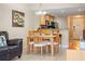 Dining room featuring a modern table and chairs, open to the kitchen with granite countertops at 11605 Gulf Blvd # 203, Treasure Island, FL 33706