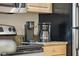 Close up of coffee makers on the countertop in the kitchen space at 11605 Gulf Blvd # 203, Treasure Island, FL 33706