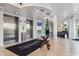 Elegant lobby with modern decor, featuring stainless elevators, a decorative table, and comfortable seating area at 11605 Gulf Blvd # 203, Treasure Island, FL 33706