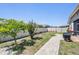 Manicured backyard featuring a brick walkway and garden with a privacy fence at 12107 Rambling Stream Dr, Riverview, FL 33569