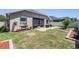 Home backyard features a brick patio and walkway with an outdoor grilling area at 12107 Rambling Stream Dr, Riverview, FL 33569
