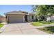 Charming single-Gathering home with a two-car garage, well-maintained lawn and mature trees at 12107 Rambling Stream Dr, Riverview, FL 33569
