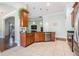 Stylish kitchen with stainless appliances, stone countertops, tile floors, and light-colored walls at 12107 Rambling Stream Dr, Riverview, FL 33569