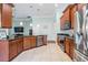Spacious kitchen with stainless steel appliances, tile floors, and plenty of cabinet space at 12107 Rambling Stream Dr, Riverview, FL 33569