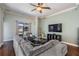 Inviting living area with hardwood floors, neutral colors, and sliding doors that lead to a backyard at 12107 Rambling Stream Dr, Riverview, FL 33569